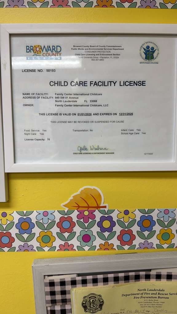 Framed Child Care Facility License from Broward County, Family Center International Childcare LLC, #50193, valid through 12/31/2026.